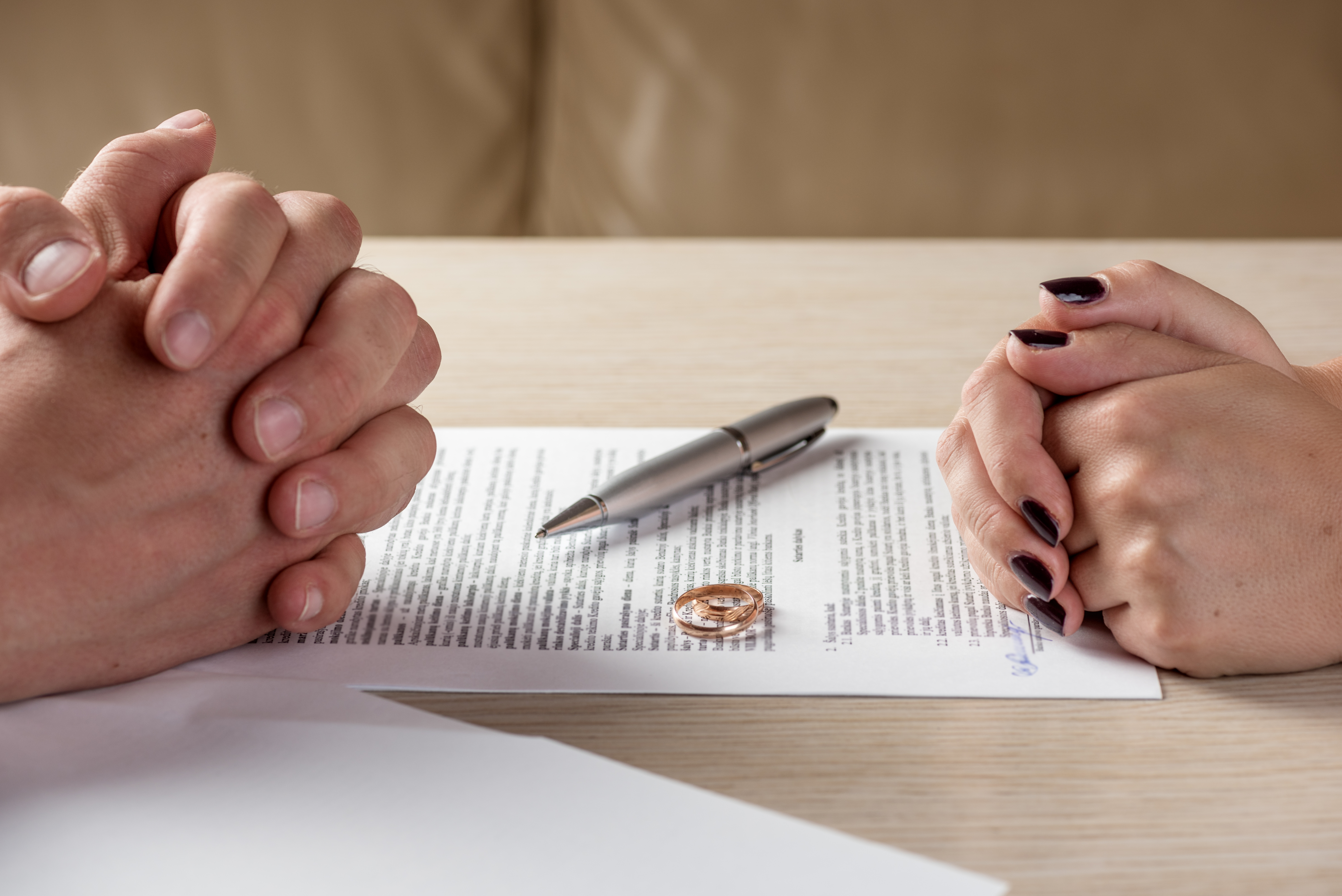 husband and wife signing divorce decree